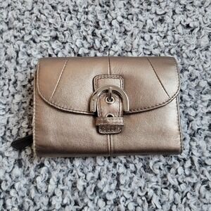 Coach bronze gold trifold wallet front buckle detail glam bling quiet luxury